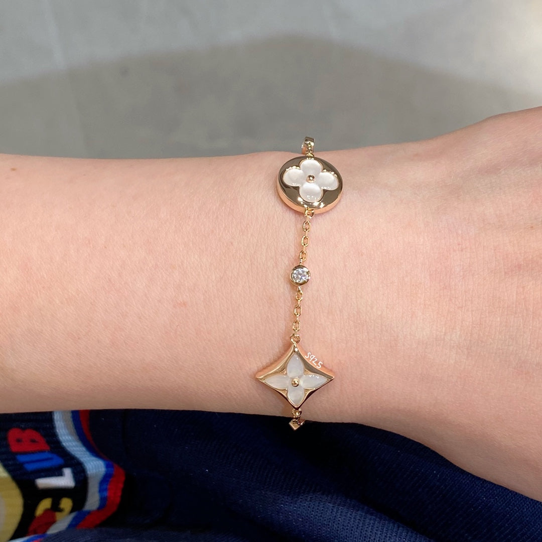 [Solara Jewelry ]STAR AND SUN 4 MOTIF WHITE MOP PINK GOLD BRACELET