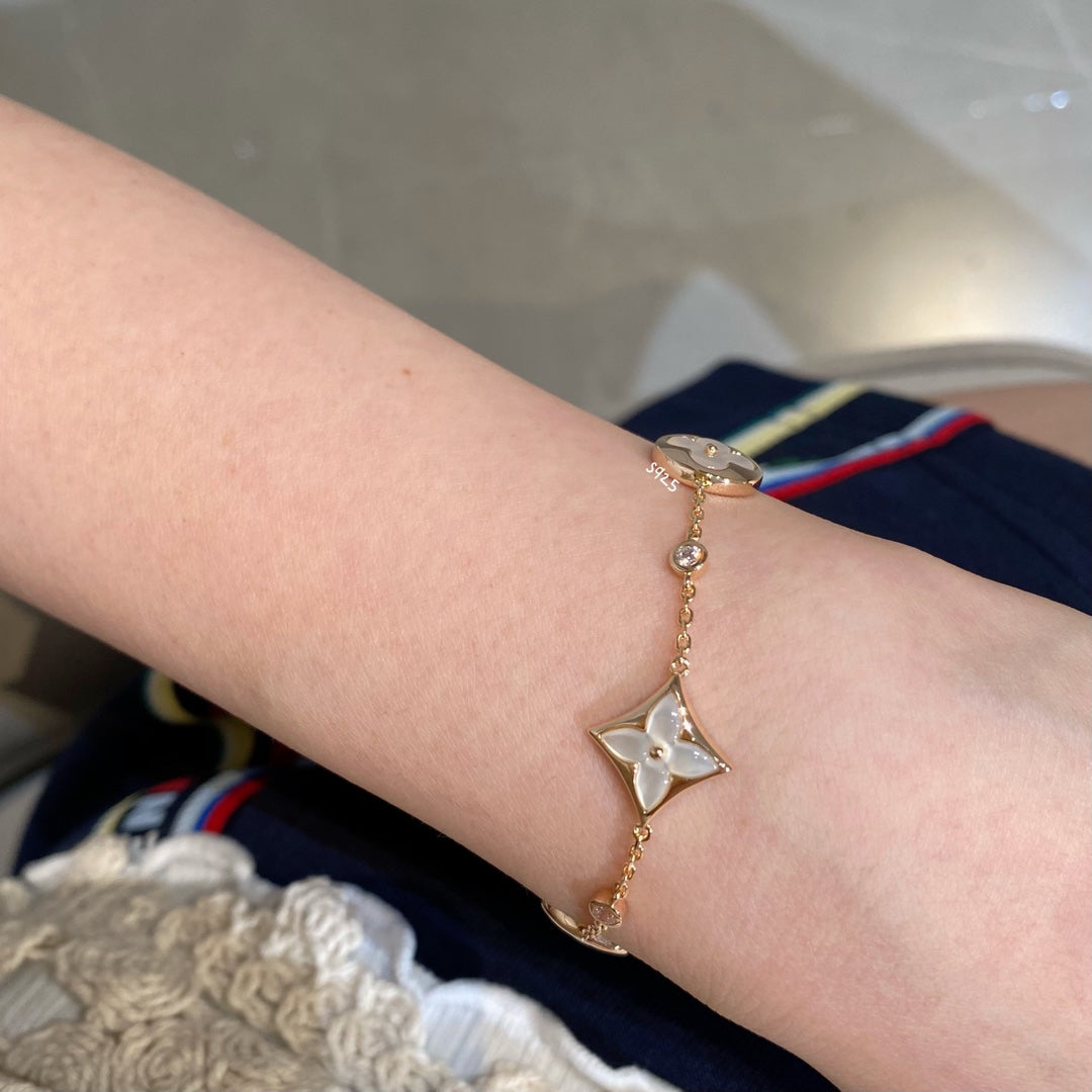 [Solara Jewelry ]STAR AND SUN 4 MOTIF WHITE MOP PINK GOLD BRACELET
