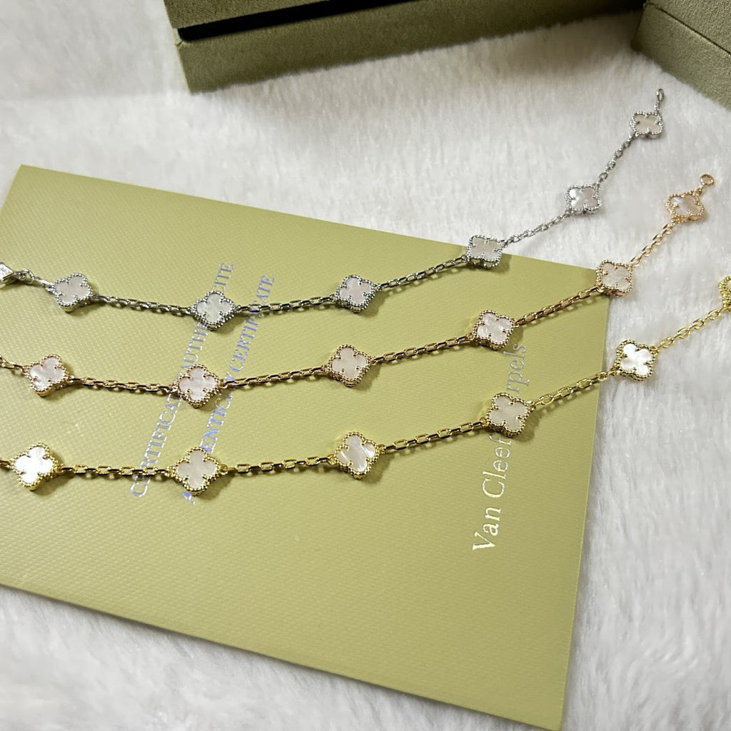 [Solara Jewelry ]KLEEBÜTTCHEN-ARMBAND MIT 6 MOTIVEN, WEISSES PERLMUTT