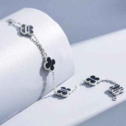 [Solara Jewelry ]KLEEBÜTE 5 MOTIV GEÄDERTER ONYX-ARMBAND SILBER